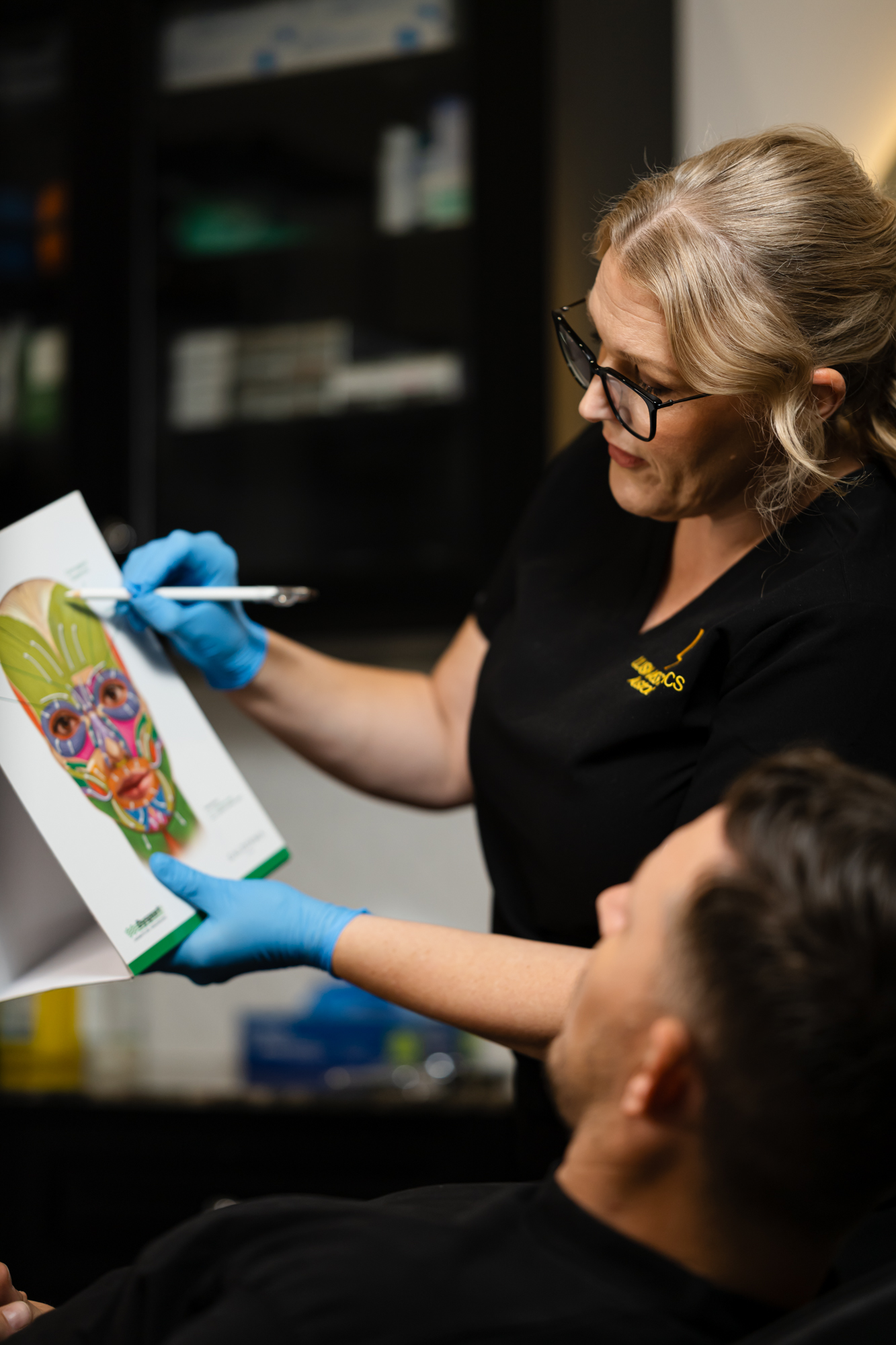 Registered nurse Amanda performing facial assessment at Lush Aesthetics Australia in Logan