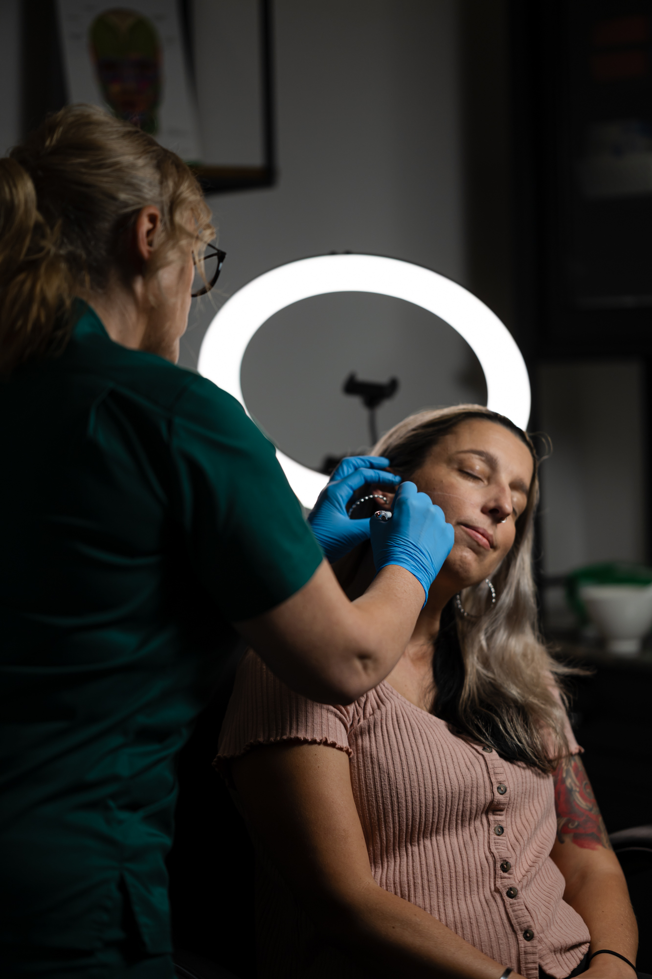 Registered nurse Amanda performing facial assessment at Lush Aesthetics Australia in Logan
